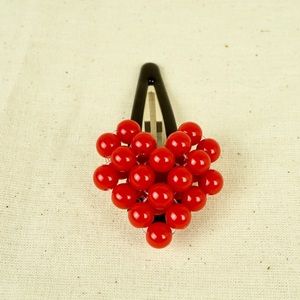 Handmade beaded heart hair clip.